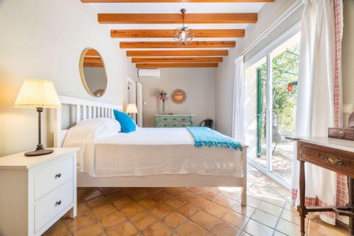 A bed or beds in a room at Finca Santa Maria Near Palma