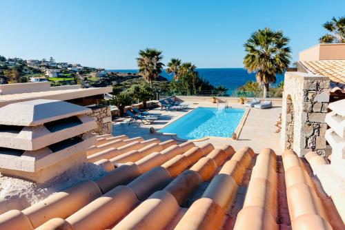 a view from the roof of a house with a swimming pool at Kiki's Seaview Villa in Gerani