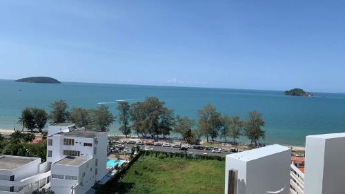 a view of a city with the ocean and buildings at Otres Beach Hotel in Sihanoukville