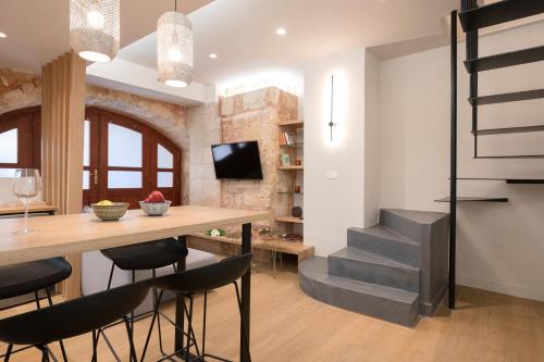 a kitchen and dining room with a table and chairs at Hanim Boutique Hotel in Chania Town