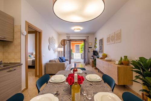 a kitchen and a living room with a table and chairs at Villaelena in Marittima