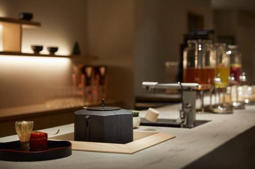 a counter top with a black box on top of it at Agora Kyoto Karasuma in Kyoto