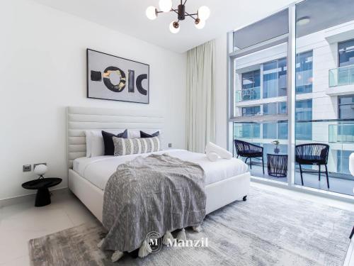 Postel nebo postele na pokoji v ubytování Manzil - Luxury 1BR Apartment in District One with access to Crystal Lagoon