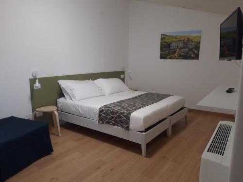 Ein Bett oder Betten in einem Zimmer der Unterkunft BAGLIO TRAMONTANA