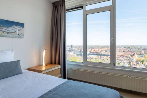 Katil atau katil-katil dalam bilik di Strandappartementen De Gulden Stroom