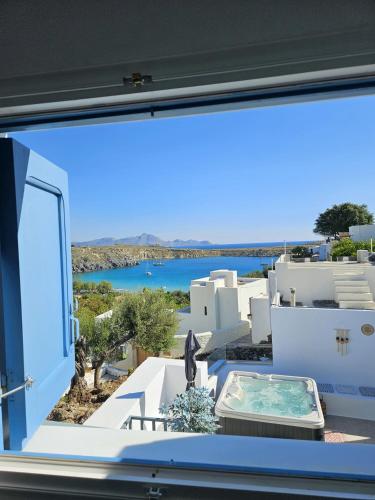 a window with a view of the sea at Villa Euphrosyne in Líndos
