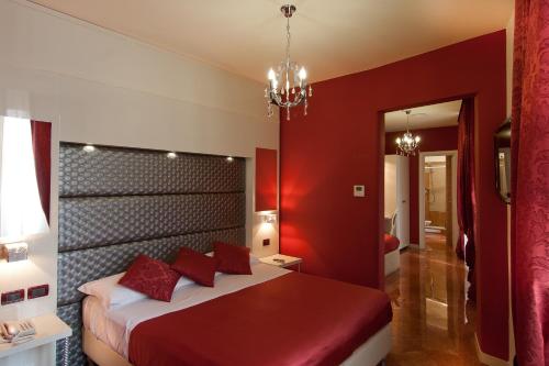 Кровать или кровати в номере Hotel Fellini