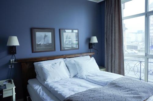 Un ou plusieurs lits dans un hébergement de l'établissement Home Hotel Bastion