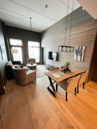 a living room with a table and a couch at Trysil Alpine Lodge in Trysil