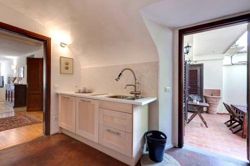 a kitchen with a sink and a counter top at Alfani Deluxe Apartment by Mamo Florence in Florence