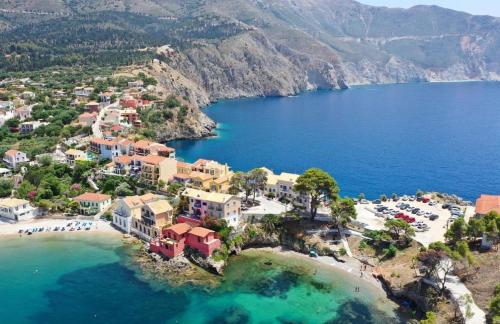 an aerial view of a resort and a beach at Assos BLUE house in Asos