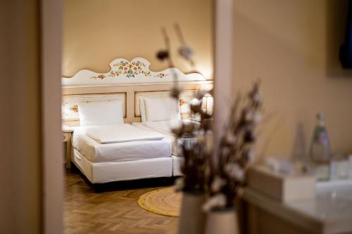 Кровать или кровати в номере Wolkendorf Bio Hotel & Spa