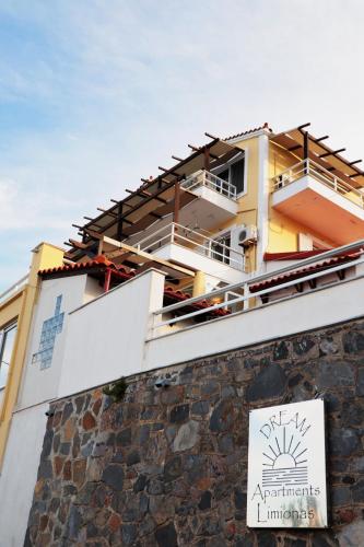 a building on top of a stone wall at Dream apartments limnionas in Limniónas