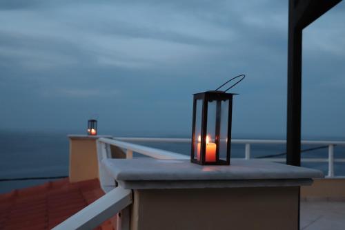 a candle sitting on top of a table on a boat at Dream apartments limnionas in Limniónas