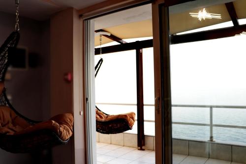 a room with a view of the ocean through a sliding glass door at Dream apartments limnionas in Limniónas