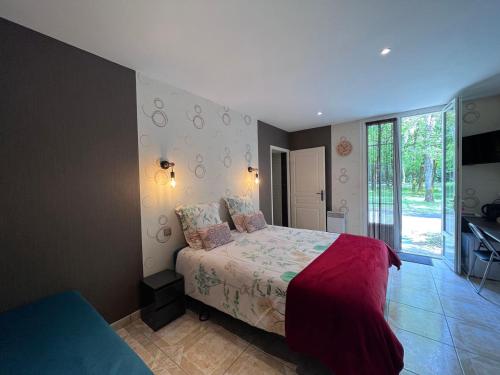 Postel nebo postele na pokoji v ubytování Villa de l’Eguille