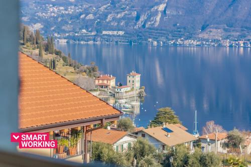 a view of a lake with houses and mountains at Incanto Apartment by Wonderful Italy in Bellagio