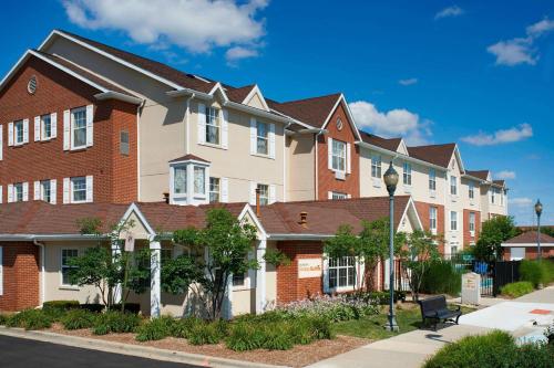 a row of houses on the side of a street at Sonesta Simply Suites Detroit Novi in Novi