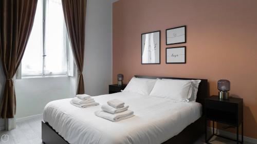 En eller flere senge i et værelse på Liberty Home