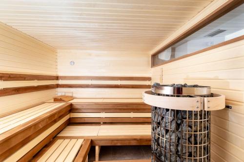a sauna with a tub in the middle at Chata Tale - Dom Horskej služby in Tale