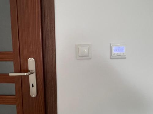 a close up of a door with a light switch at Noclegi - Pokoje - STEMPO in Skarżysko-Kamienna
