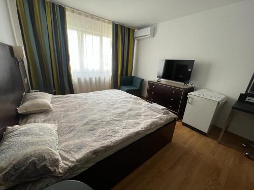 Regim Hotelier Tecuci - Zona Industriala tesisinde bir odada yatak veya yataklar