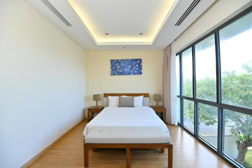 Letto o letti in una camera di Daisy Ocean Villa Da Nang