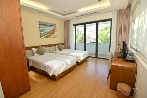 Letto o letti in una camera di Daisy Ocean Villa Da Nang