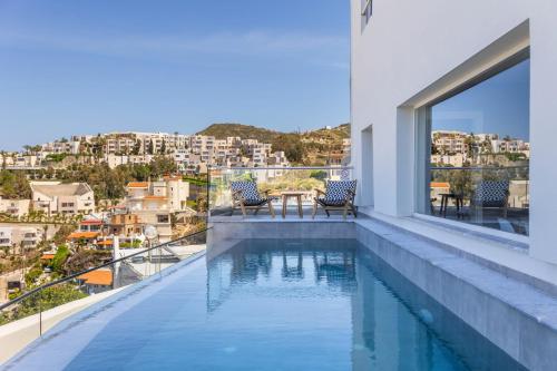 a swimming pool on the balcony of a house at Stelianas House Ground Floor Apartment with Private Pool in Lygaria