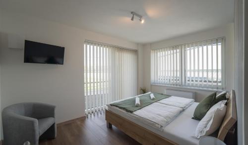 Säng eller sängar i ett rum på VULCANO Guesthouse