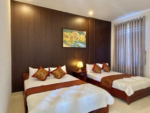 Katil atau katil-katil dalam bilik di Hoàng Ngân Hotel Phú Yên