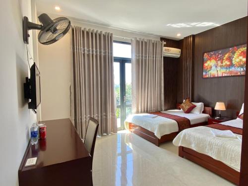 Katil atau katil-katil dalam bilik di Hoàng Ngân Hotel Phú Yên
