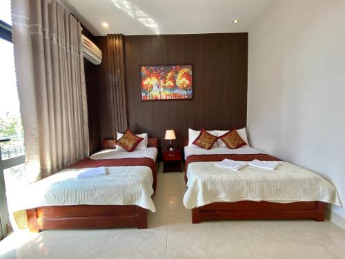 Katil atau katil-katil dalam bilik di Hoàng Ngân Hotel Phú Yên
