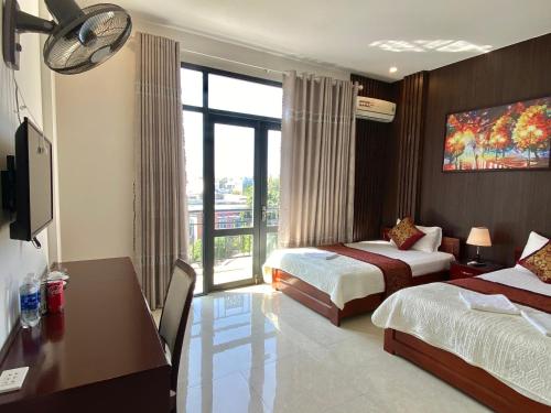 Katil atau katil-katil dalam bilik di Hoàng Ngân Hotel Phú Yên