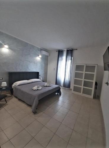 a bedroom with a bed and a table in it at La Nchioscia in La Spezia