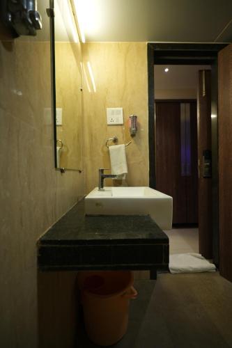 Кровать или кровати в номере Hotel City Symphony