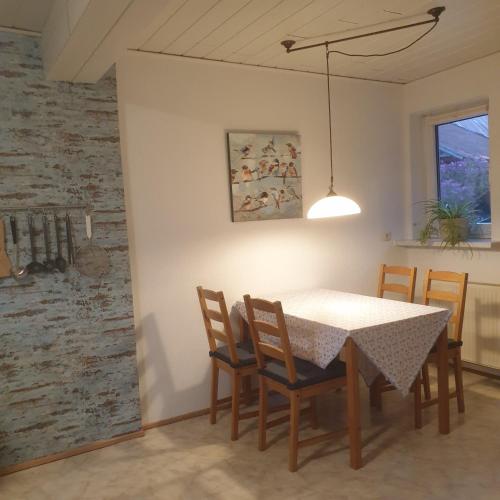 a dining room with a table and chairs at radlerunterkunft Grabau Nr.1 in Grabau