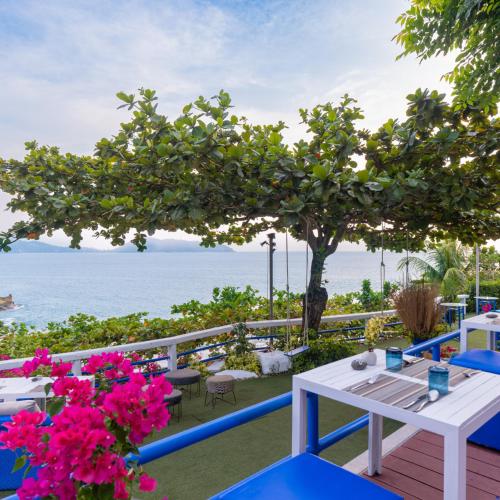 a view of the ocean from the deck of a resort at Zenmaya Oceanfront Phuket, Trademark Collection by Wyndham in Patong Beach
