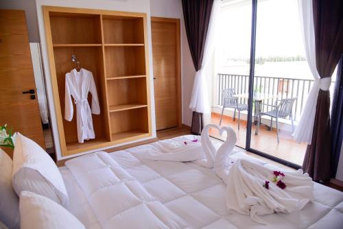Postel nebo postele na pokoji v ubytování Hotel beaux arts