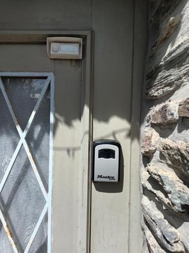 a door with a toaster on the side of a building at Appartneuville in Vielsalm