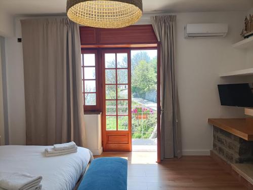 Ένα ή περισσότερα κρεβάτια σε δωμάτιο στο Casa Teranga