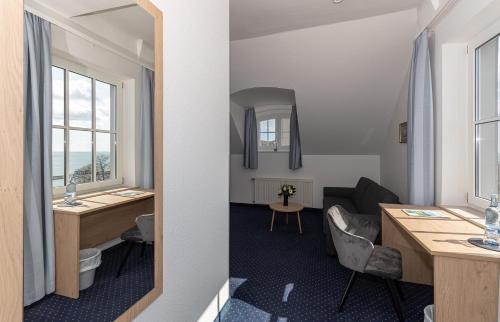 a room with a view of a living room at Kurhotel Sassnitz in Sassnitz