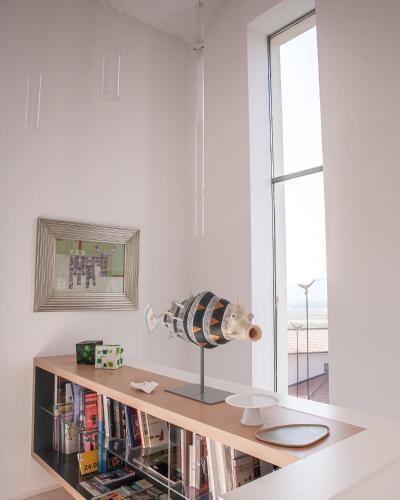 a room with a book shelf with a vase on it at Villa Alma Vista in Dobrovo