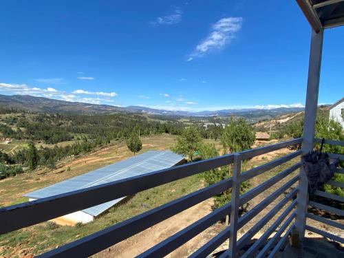 a view from the balcony of a house with a road at Chalet Familiar Delpilar, Full equipado, zona de Jacuzzi! in Sogamoso