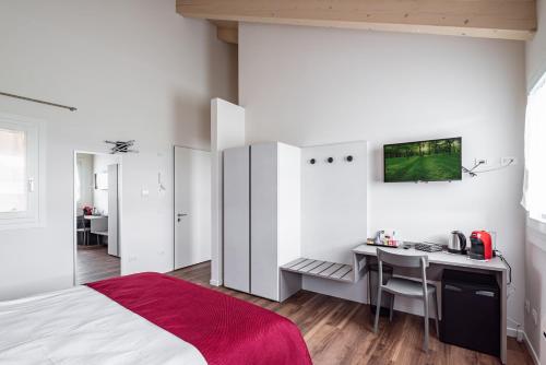 מיטה או מיטות בחדר ב-Ca MIA Rododendro & Mughetto Rooms