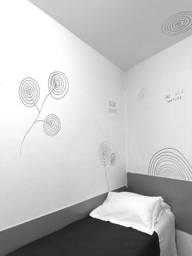 Una cama o camas en una habitación de Boutique Hotel Novecento