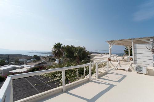 a balcony with a view of the ocean at Blue Bay Heliolithos in Parikia