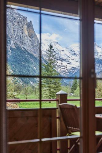 a window with a view of a mountain view at Apartment Mountain View, Luxury, Spacious with best Views in Lauterbrunnen