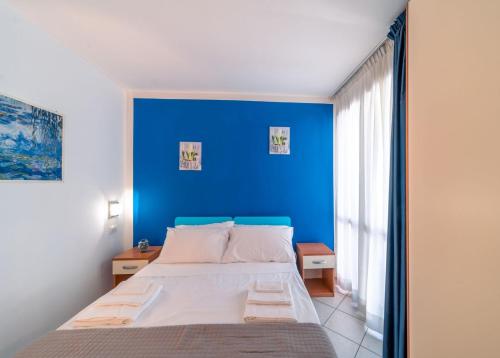 Ένα ή περισσότερα κρεβάτια σε δωμάτιο στο Residence Alessandra