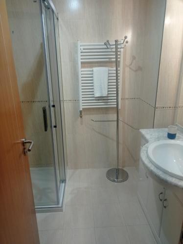a bathroom with a shower and a sink at Apartamentos Vila Verde T3 in Ponte de Lima
